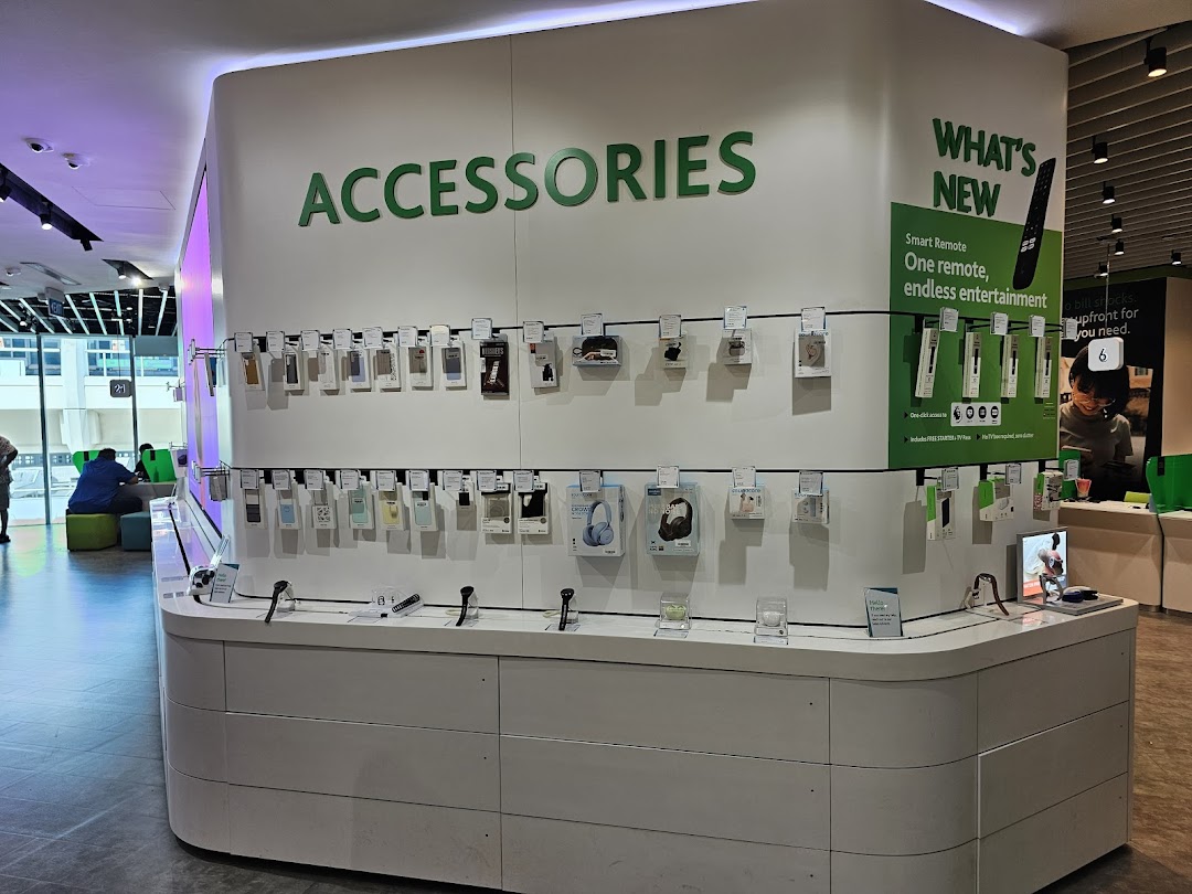 Interior view of StarHub Tampines Mall, featuring a prominent display of mobile accessories and smart remotes.