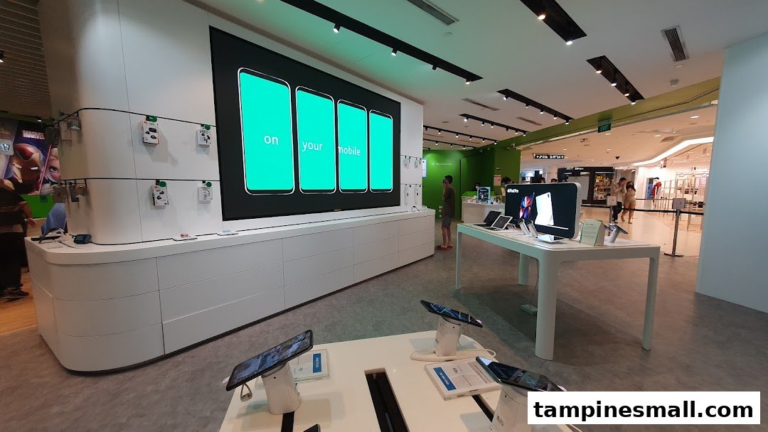Interior view of StarHub store showcasing mobile devices, tablets, and a large digital display.