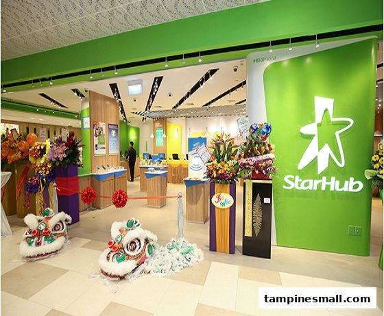 Vibrant StarHub shop entrance with festive lion dance decorations and welcoming floral arrangements.
