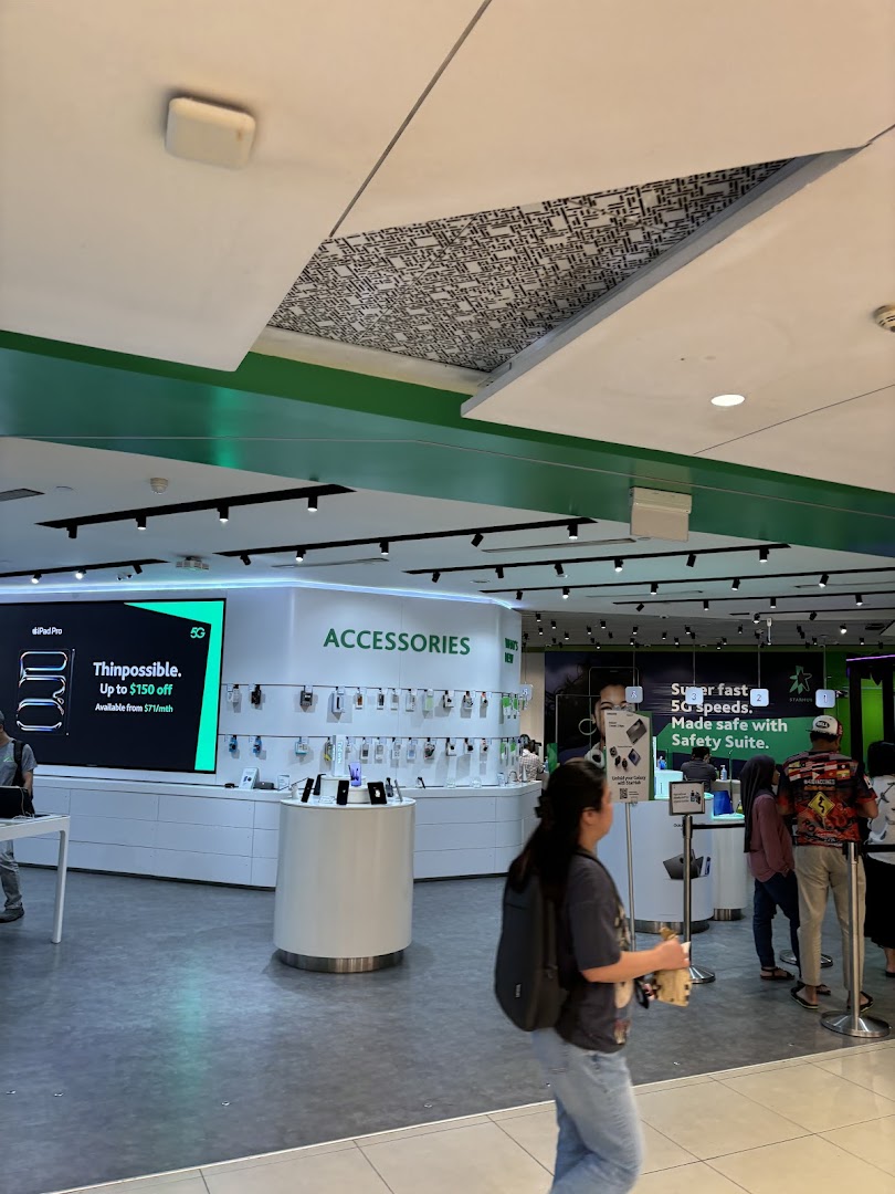 Interior view of StarHub Tampines Mall, showcasing mobile accessories, devices, and customer service areas.