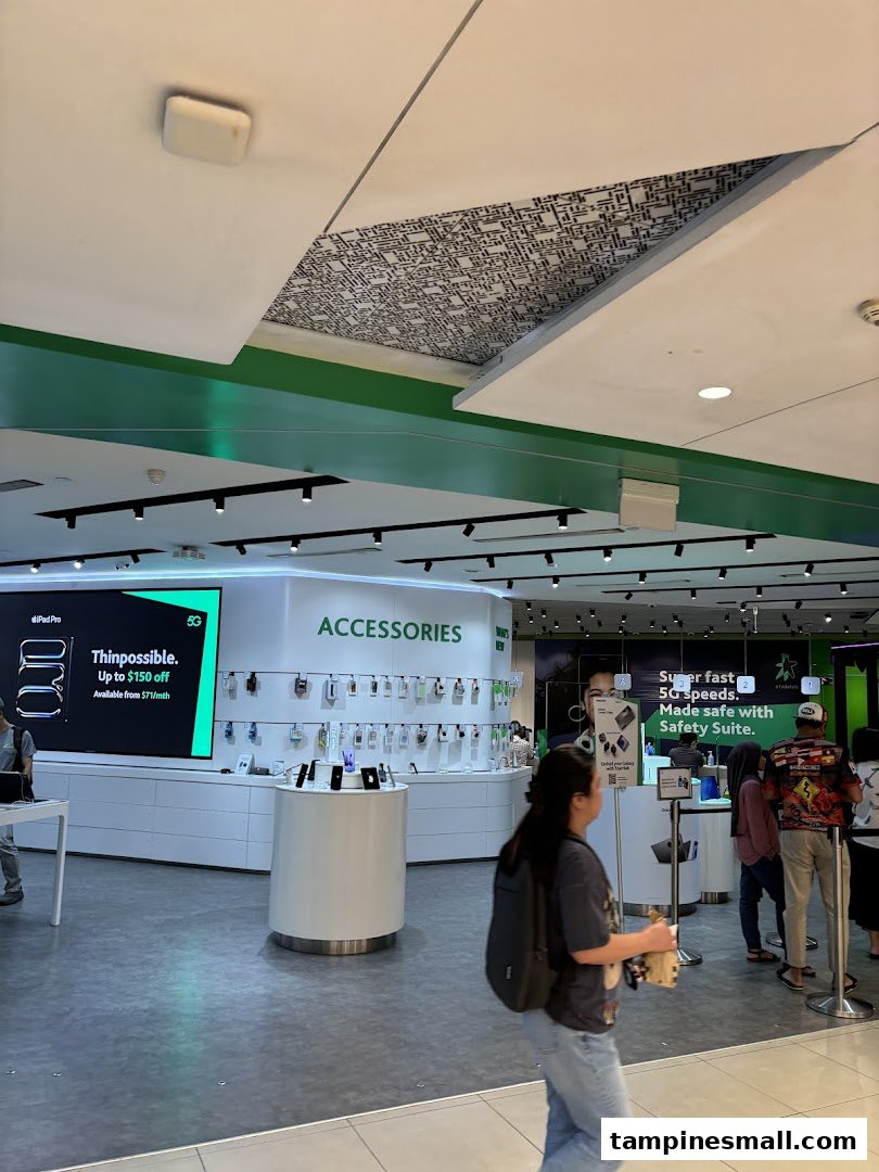 Interior view of StarHub Tampines Mall, showcasing mobile accessories, devices, and customer service areas.