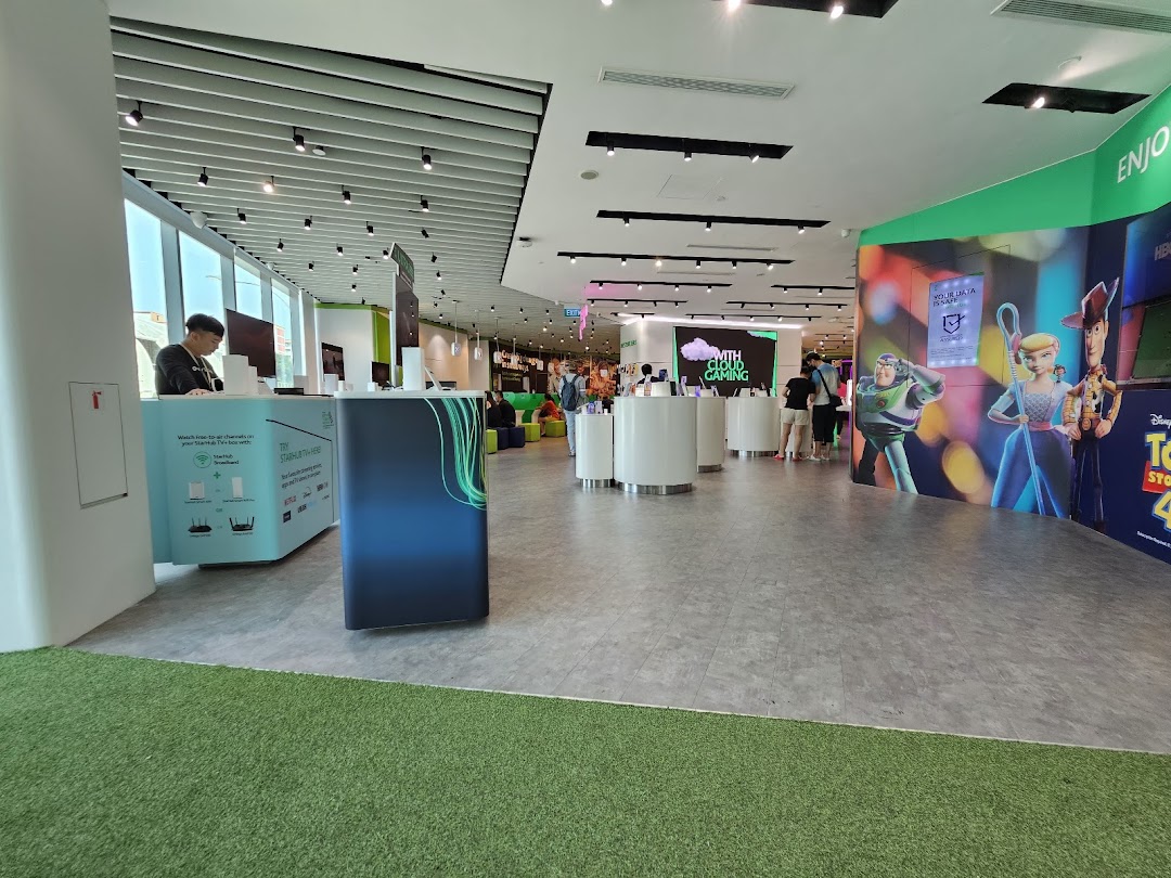 An interior view of StarHub Tampines Mall, showcasing product displays and customer service counters.