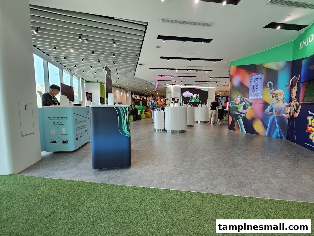 An interior view of StarHub Tampines Mall, showcasing product displays and customer service counters.