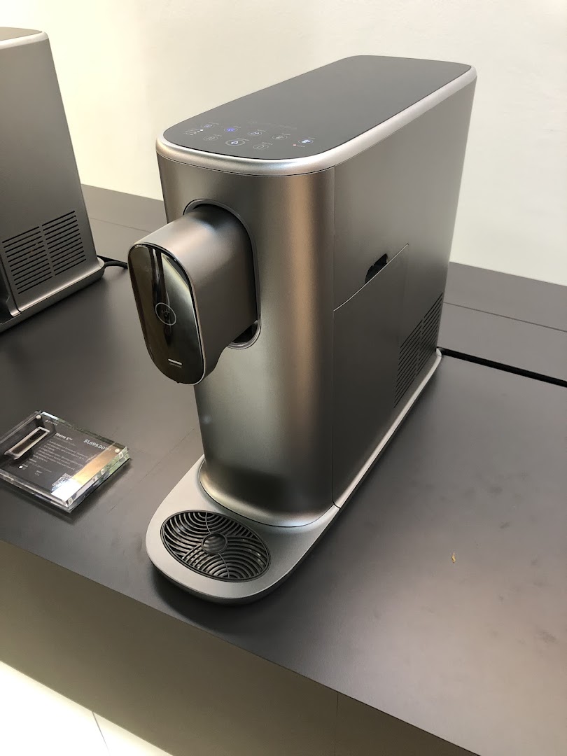 A sleek, modern Sterra water purifier displayed in the shop.