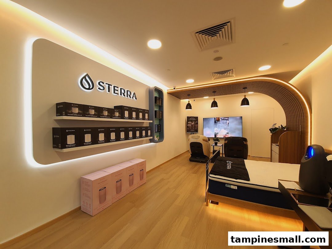 Interior view of Sterra Singapore, showcasing air purifiers, a mattress, and massage chairs.