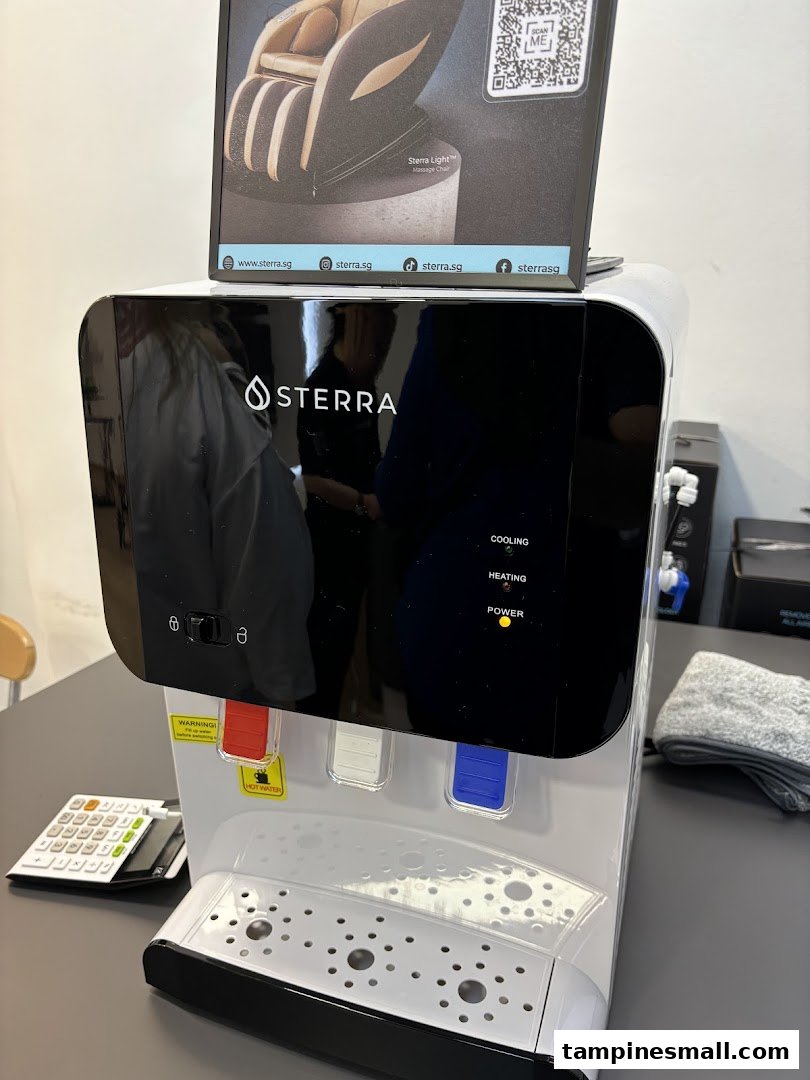 A Sterra water dispenser and a display for a Sterra Light Massage Chair in the shop.