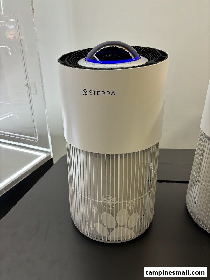 A white Sterra air purifier with pet paw print design on display.