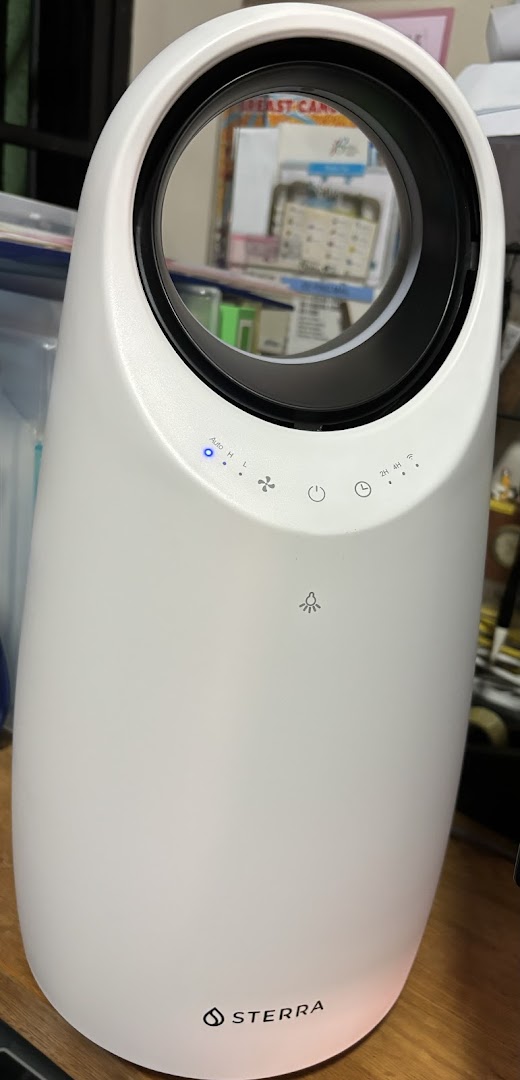 A white Sterra air purifier/humidifier with control panel and logo visible.