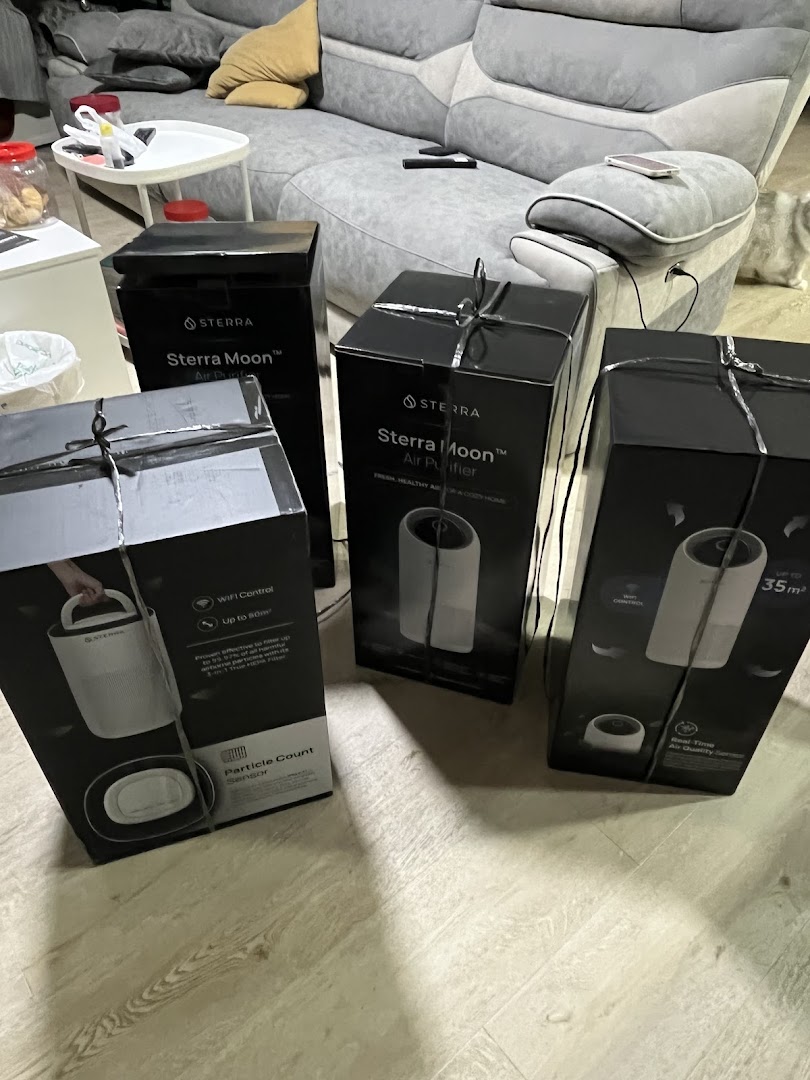 Several Sterra Moon Air Purifier boxes are displayed in a home setting.