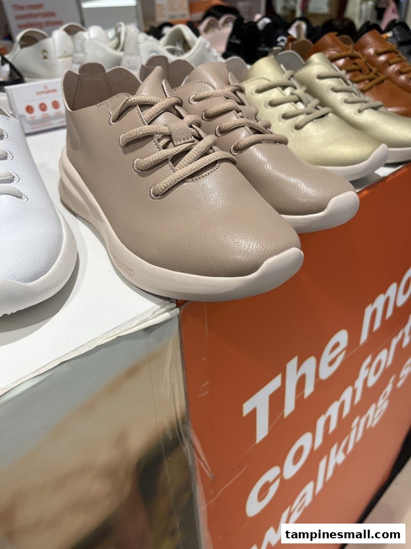 Close-up of Sunnystep comfortable walking shoes in various colors displayed in the store.