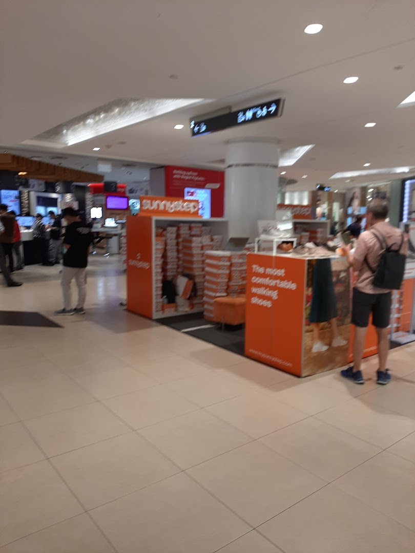 An interior view of the Sunnystep kiosk in Tampines Mall, showcasing comfortable walking shoes.