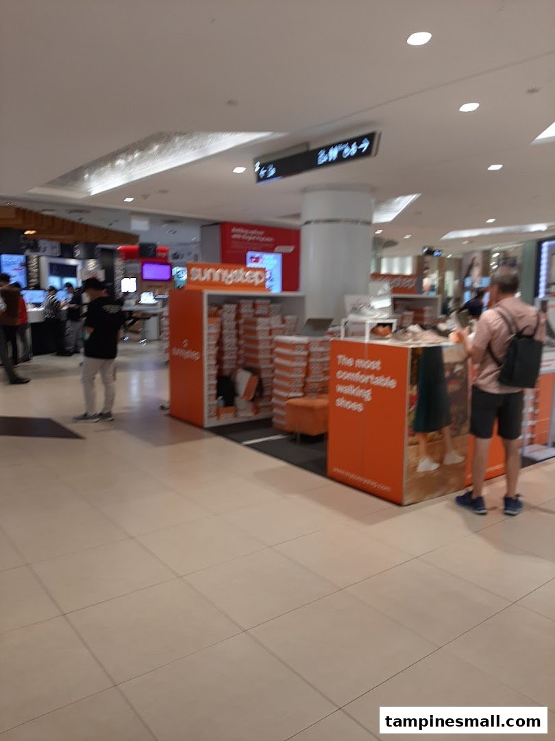 An interior view of the Sunnystep kiosk in Tampines Mall, showcasing comfortable walking shoes.