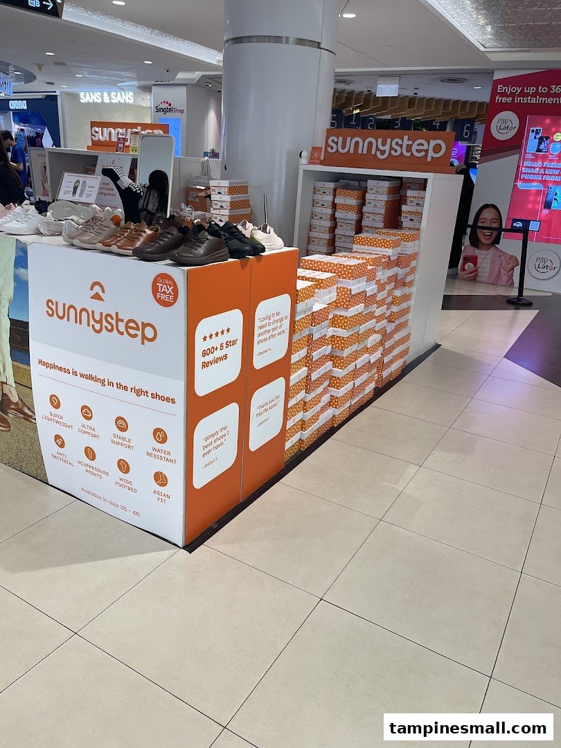 A Sunnystep retail display showcasing various comfortable shoes and brand features in a mall.