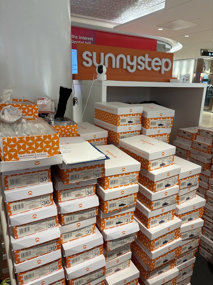 An interior view of Sunnystep, showcasing numerous stacks of shoe boxes with various models and sizes.