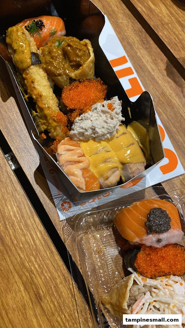 A vibrant assortment of sushi and Japanese dishes in takeaway packaging from Super Sushi.