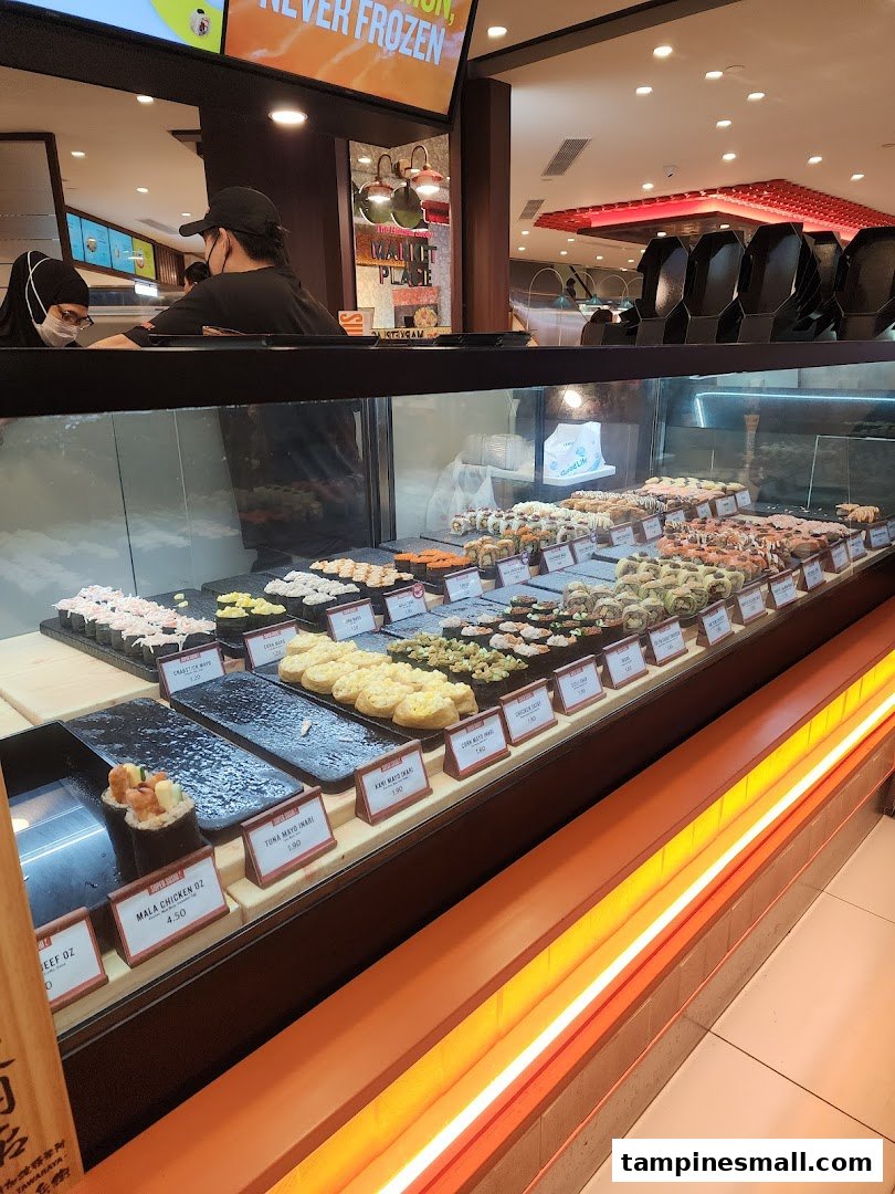 A vibrant display of fresh sushi and Japanese dishes in a refrigerated counter at Super Sushi.
