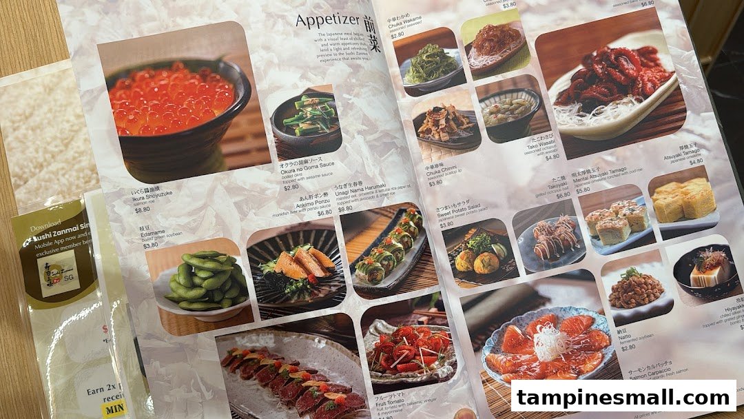 A page from Sushi Zanmai's appetizer menu, showcasing various Japanese small dishes with images and prices.