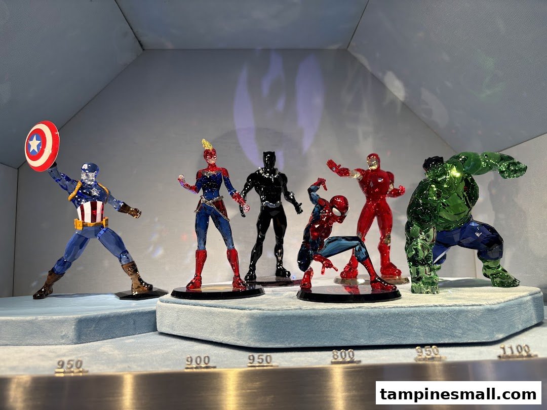 A display of Swarovski crystal Marvel superhero figurines, including Captain America, Hulk, and Spider-Man.