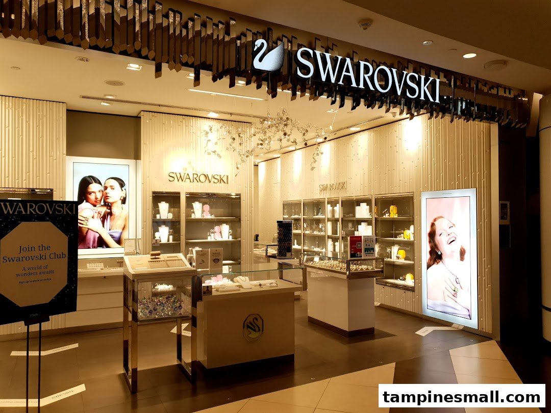 The brightly lit entrance of a Swarovski store showcasing sparkling crystal jewelry and accessories.