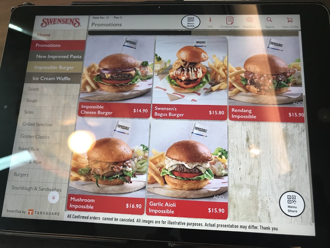A digital menu display from Swensen's, showcasing various Impossible Burger promotions with prices and images.