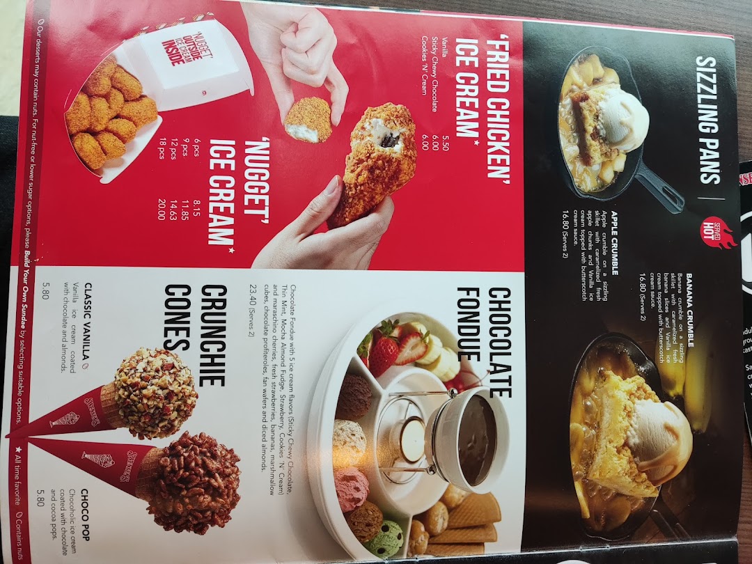 A vibrant menu showcasing Swensen's unique ice cream creations, sizzling desserts, and chocolate fondue.