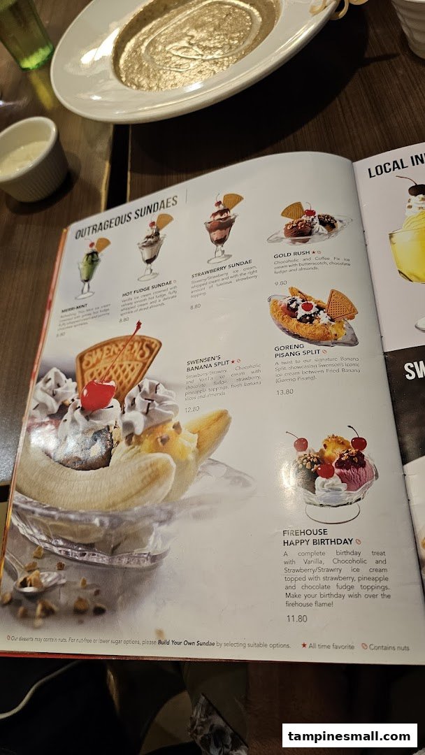 A close-up of Swensen's dessert menu, showcasing various sundaes and banana splits.