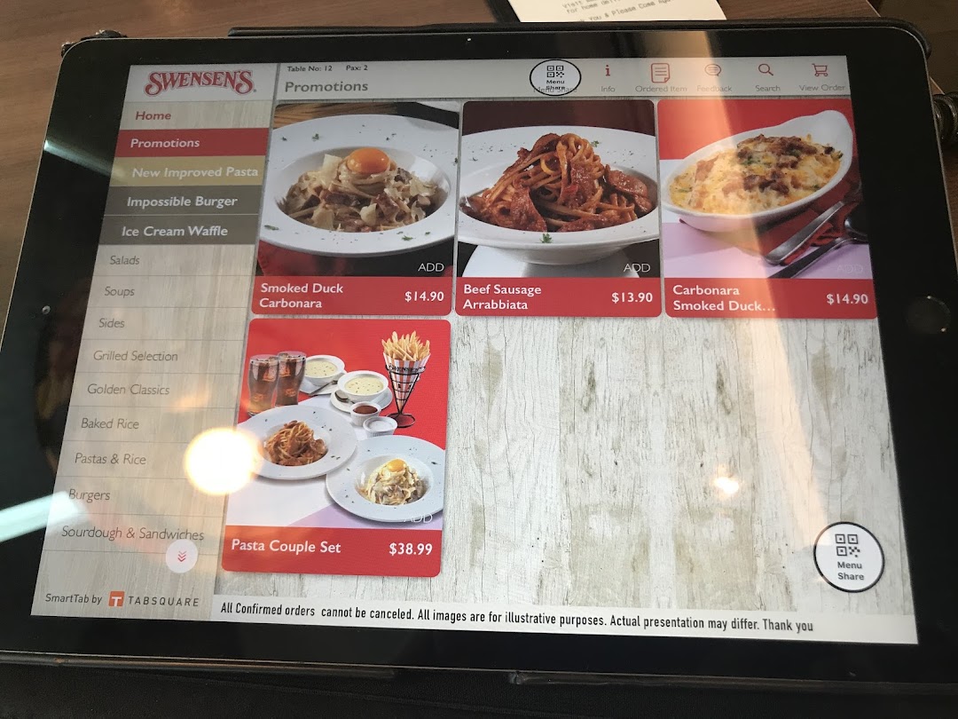 A digital menu on a tablet at Swensen's, showcasing pasta promotions and various food categories.