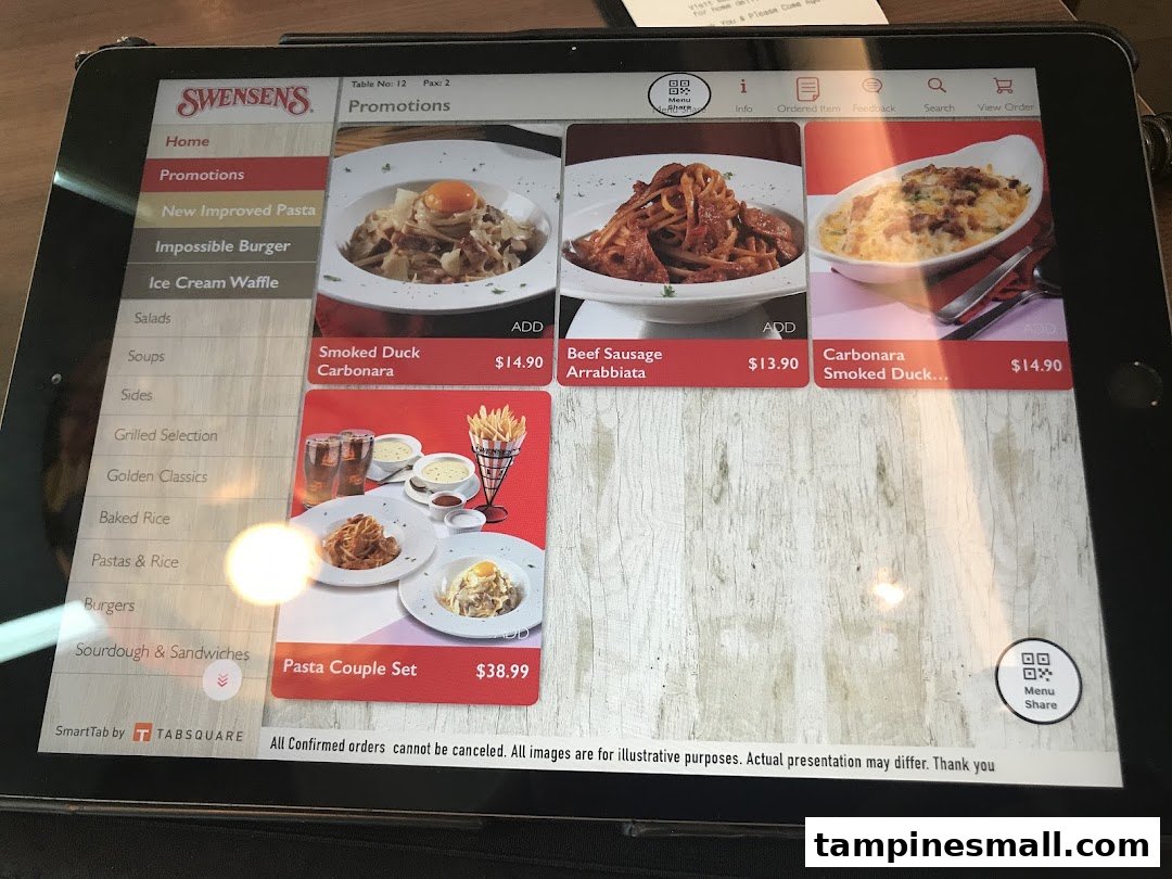 A digital menu on a tablet at Swensen's, showcasing pasta promotions and various food categories.