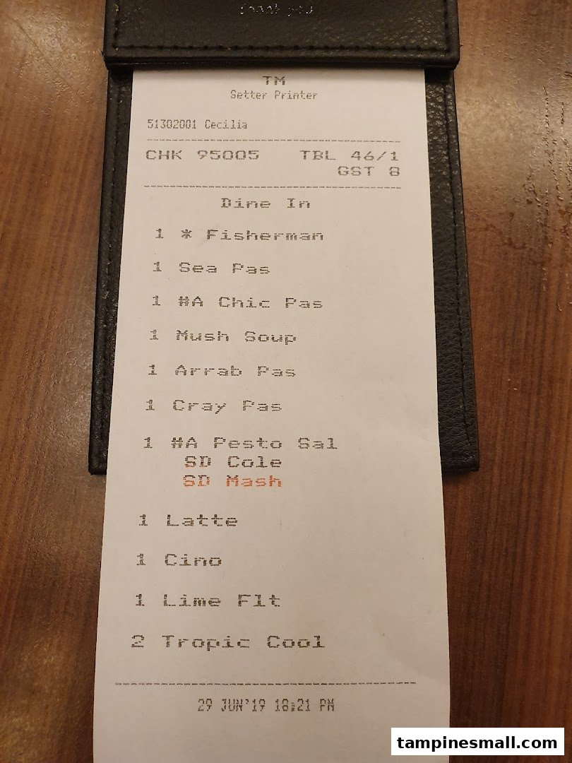 A close-up of a restaurant order slip detailing various food and beverage items.