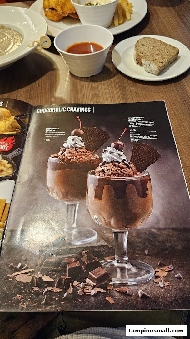 A Swensen's menu page showcasing 'Chocoholic Cravings' desserts, with other dishes visible in the background.