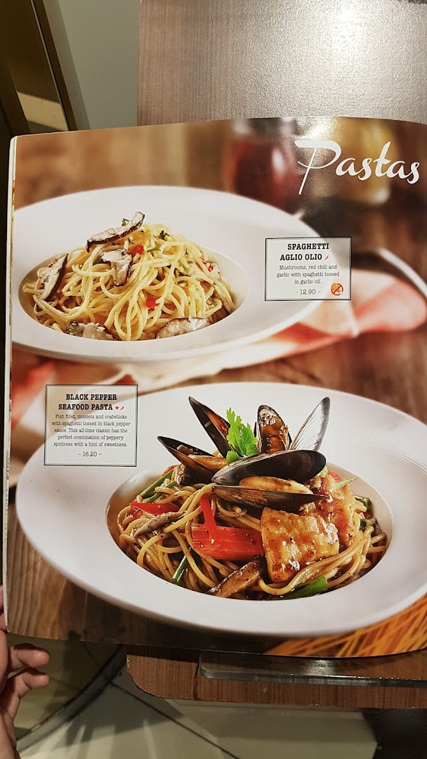 A menu page from Swensen's showcasing two pasta dishes: Spaghetti Aglio Olio and Black Pepper Seafood Pasta.