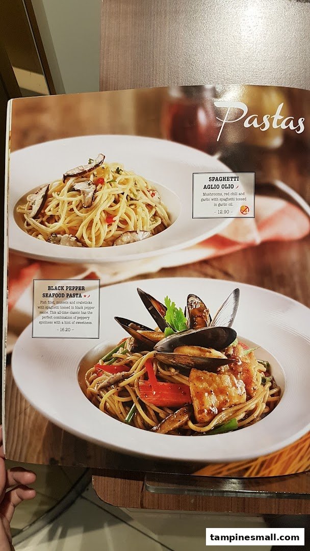 A menu page from Swensen's showcasing two pasta dishes: Spaghetti Aglio Olio and Black Pepper Seafood Pasta.