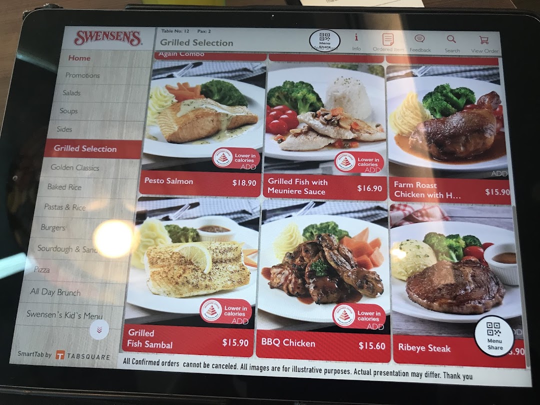 A digital menu displaying grilled dishes and other selections from Swensen's restaurant on a tablet.