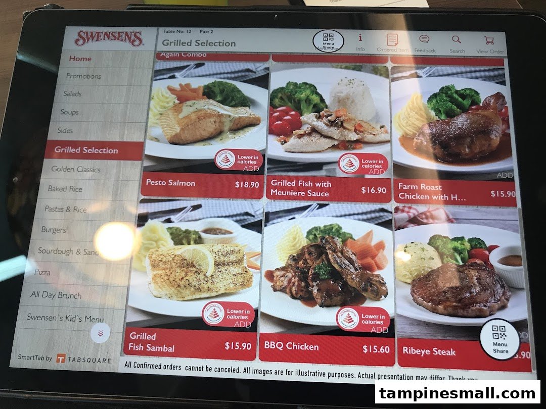 A digital menu displaying grilled dishes and other selections from Swensen's restaurant on a tablet.