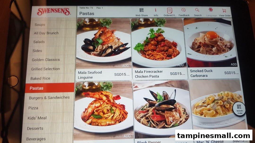 A digital menu from Swensen's, displaying various pasta dishes and menu categories on a tablet.