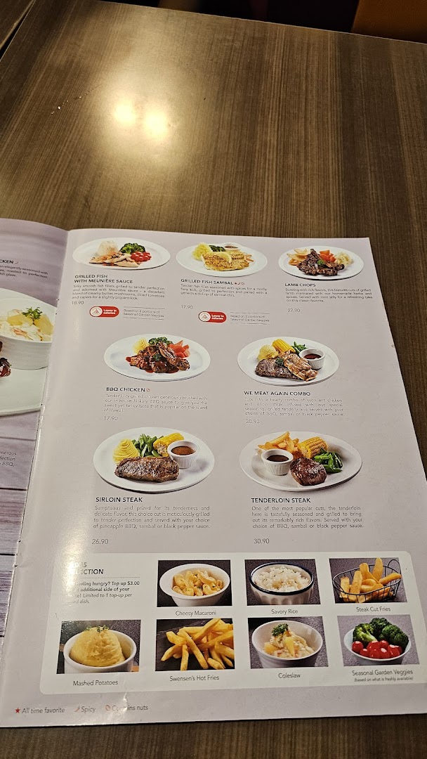 A detailed view of Swensen's menu featuring main courses like steaks, fish, chicken, and various side dishes.