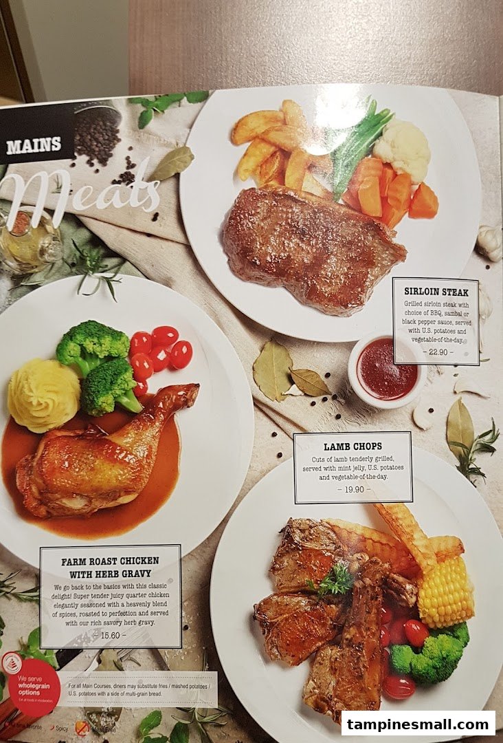 A menu page from Swensen's showcasing hearty meat main courses like steak, roast chicken, and lamb chops.