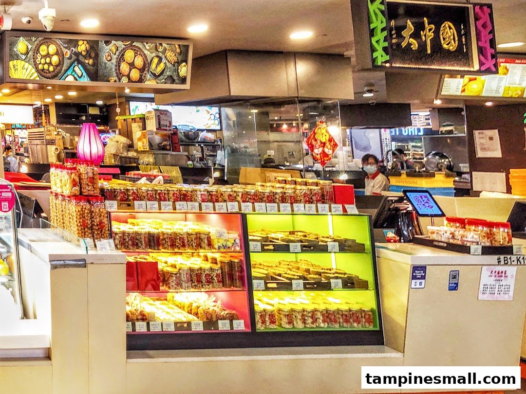 Interior view of Tai Chong Kok, showcasing numerous jars of traditional Chinese pastries and snacks on display.