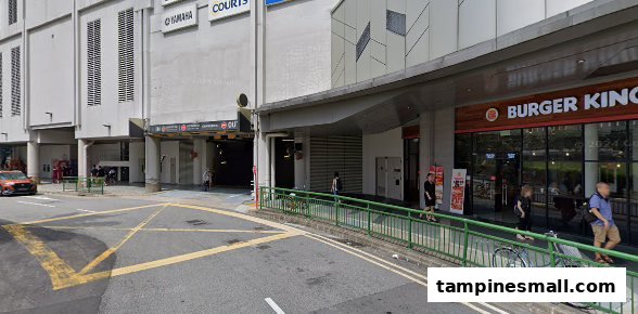 Exterior view of Tampines Mall entrance featuring Burger King and parking access.