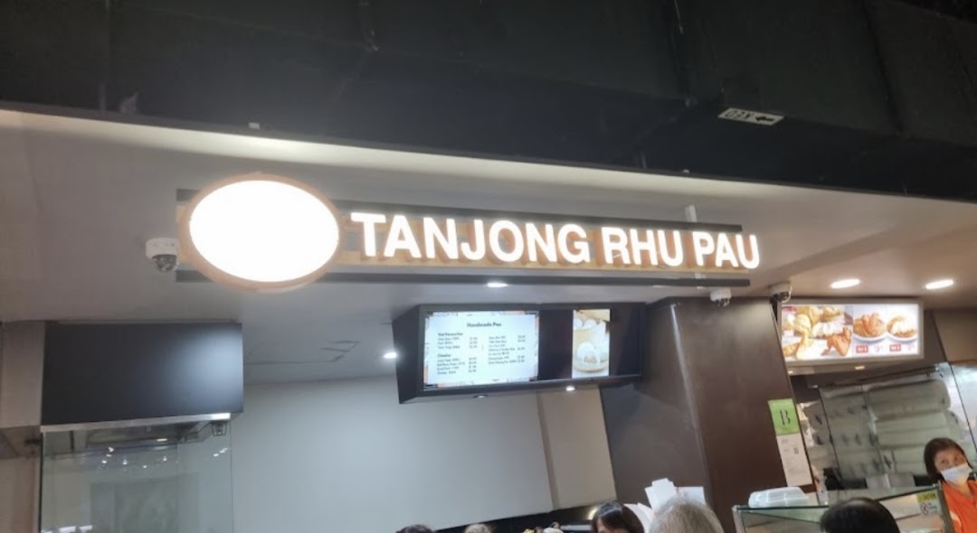A view of Tanjong Rhu Pau's counter area with its illuminated sign and digital menu board.