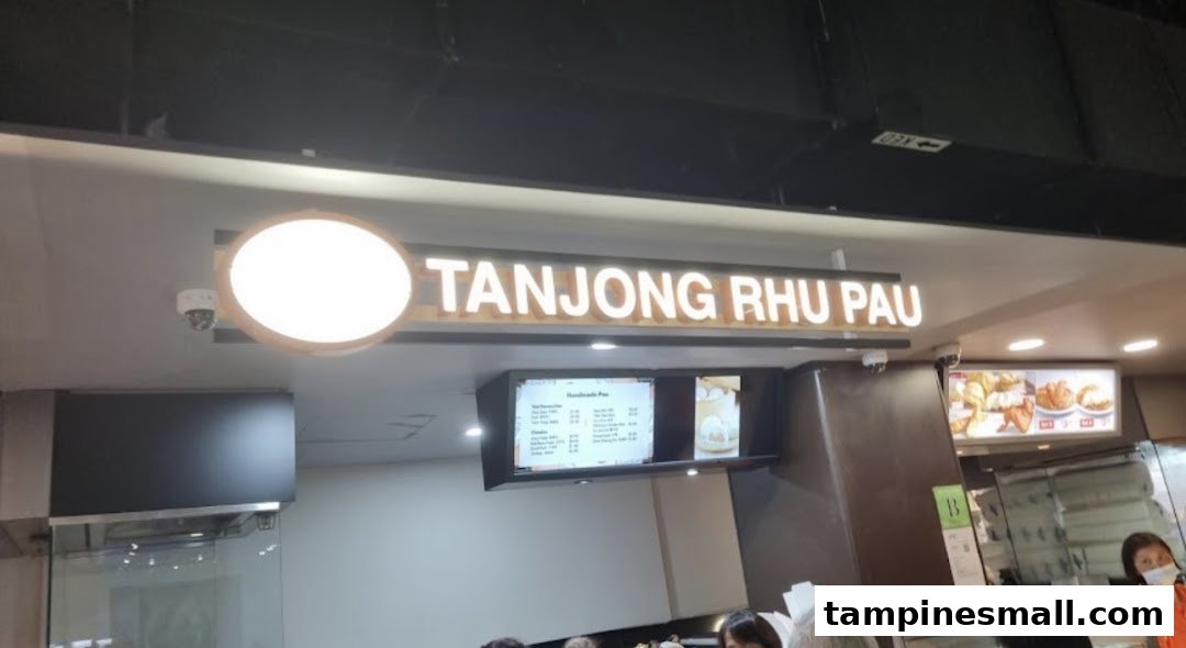 A view of Tanjong Rhu Pau's counter area with its illuminated sign and digital menu board.