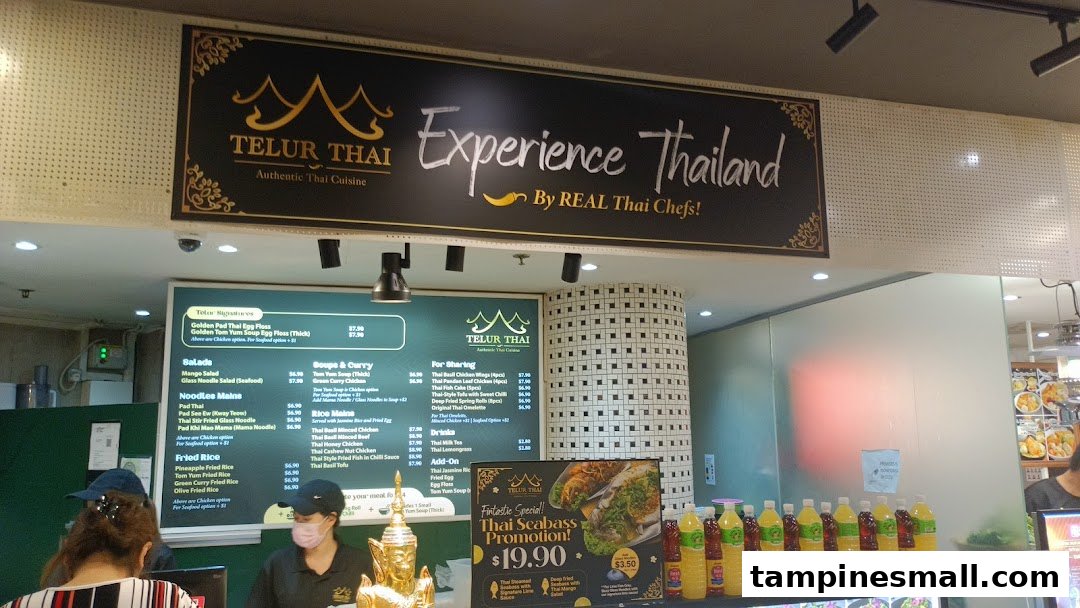 An interior shot of Telur Thai, showcasing its menu board, counter, and authentic Thai offerings.