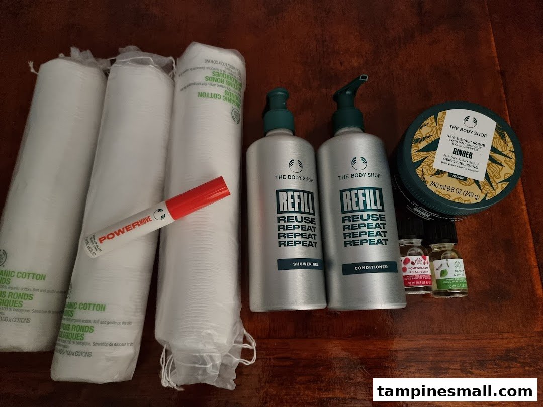 A collection of The Body Shop products, including refillable items and skincare essentials.