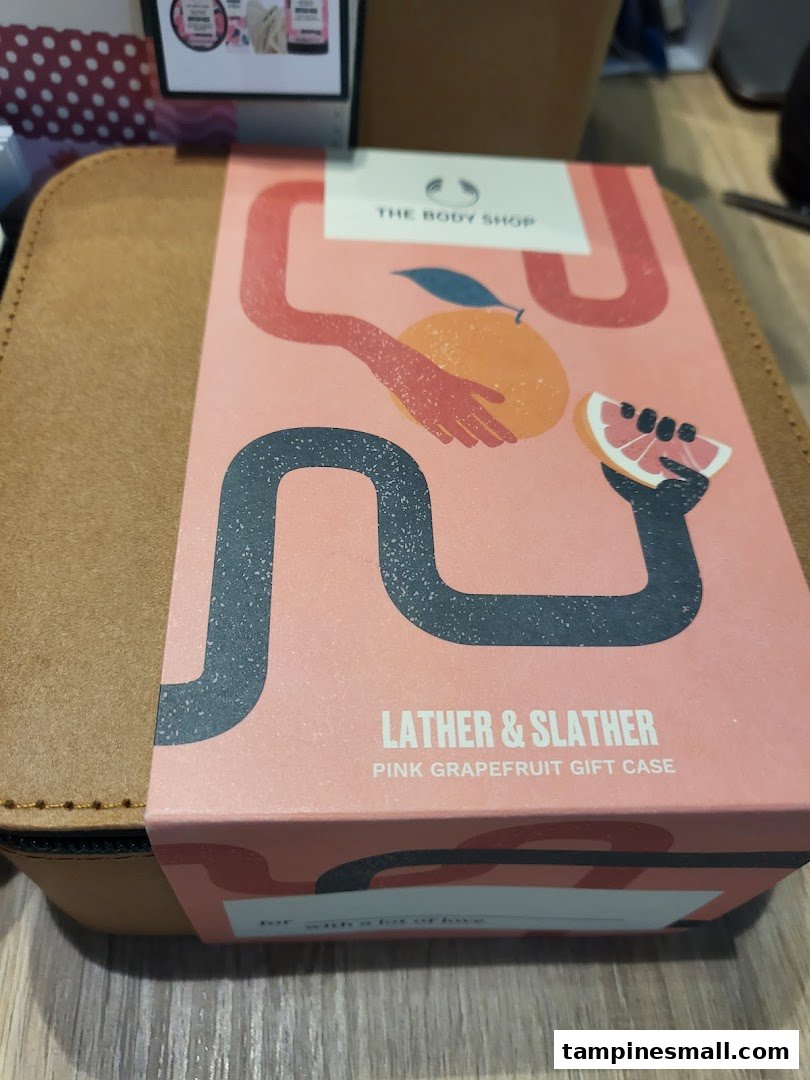 A Body Shop 'Lather & Slather Pink Grapefruit Gift Case' featuring vibrant artwork.