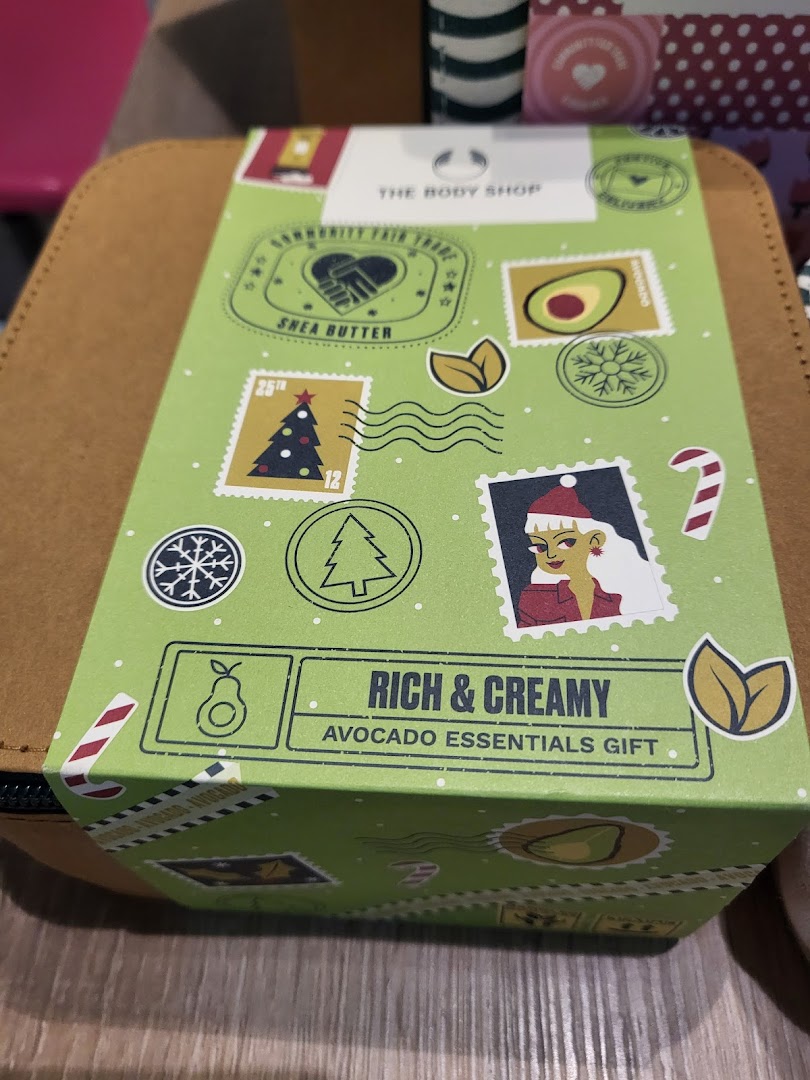 A festive 'Rich & Creamy Avocado Essentials Gift' set from The Body Shop, featuring shea butter and avocado.