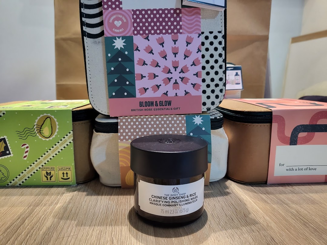 A close-up of The Body Shop products, including a Chinese Ginseng & Rice Polishing Mask and a Bloom & Glow gift set.