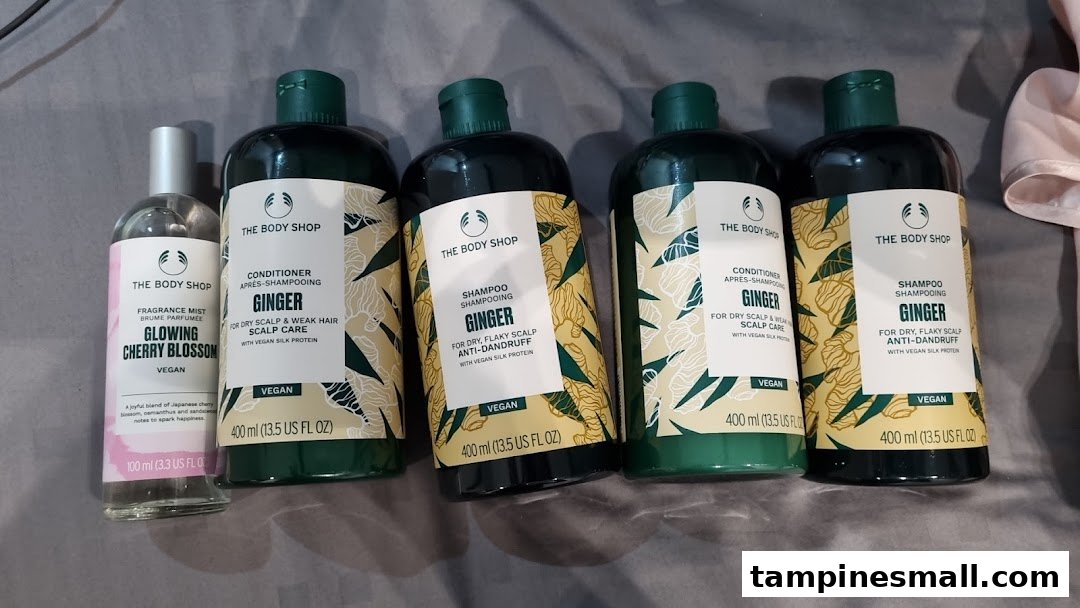 A collection of The Body Shop products, including Ginger hair care and a Glowing Cherry Blossom fragrance mist.