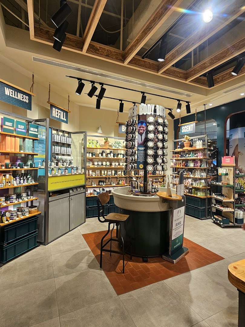 An inviting interior view of The Body Shop, showcasing various beauty and wellness products on display.