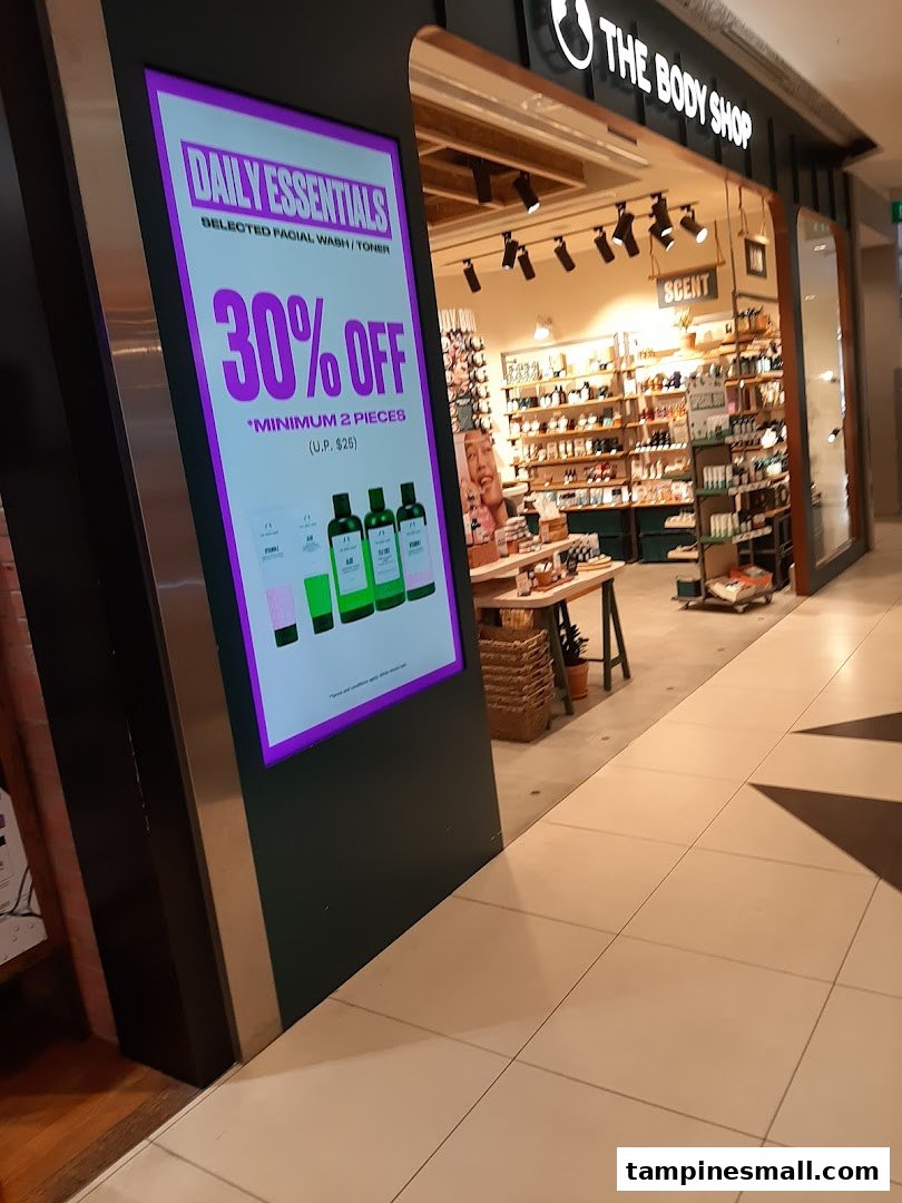 The Body Shop entrance features a prominent digital display advertising 30% off daily essentials.