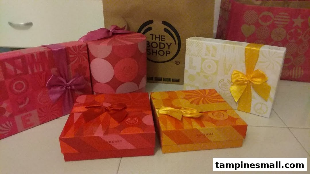 A collection of colorful gift sets and a shopping bag from The Body Shop.